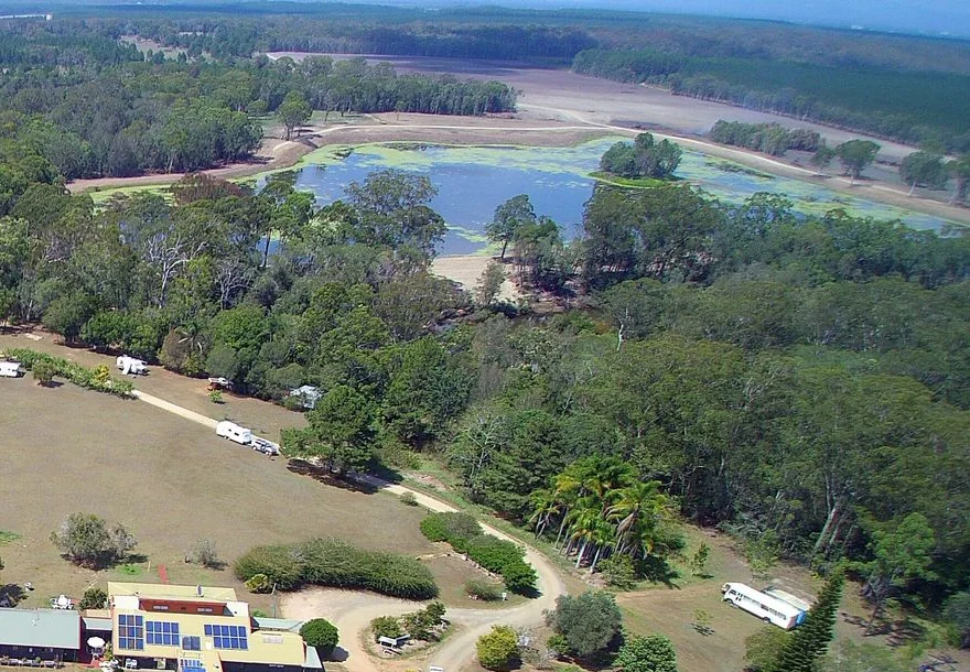 The tree-lined creek and countryside beside Pacific Sun Friends